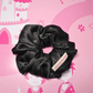 Elegant black scrunchie made of satin, eco-friendly and hand-crafted for gentle hair care.