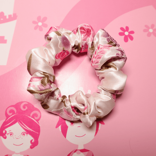 Flora Dream scrunchie in pink and green satin with floral design.