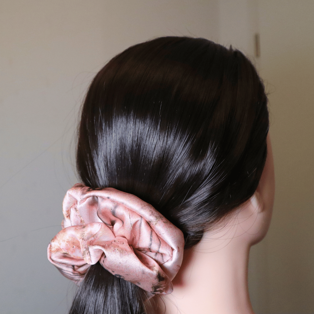Pearl satin scrunchie in pink floral, elegant and hair-friendly accessory.