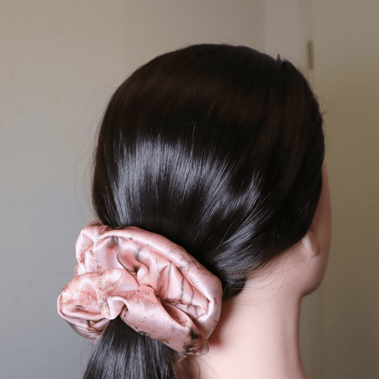 Pearl satin scrunchie in pink floral, elegant and hair-friendly accessory.