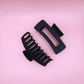 Black matte hair claw clips set on pink background, stylish and gentle Haarklammern Set