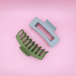 PastelPetal Haarklammern Set with matte green and gray claw clips on pink background, gentle and stylish hair accessories