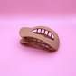 Minimalist beige matte hair claw clip from Haarklammer-Set Classic Calm on pink background