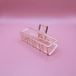 Golden Belle signature gold metal claw hair clip with rectangular design on pink background